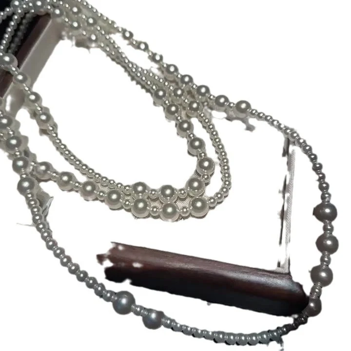 Multi-layer stacked Shijia pearl sweater chain long necklace women's round strong light Joker feeling autumn and winter accessories manufacturers batch
