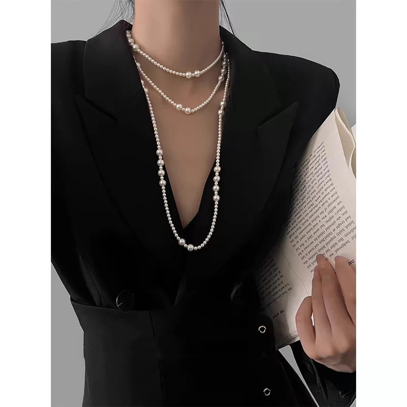Multi-layer stacked Shijia pearl sweater chain long necklace women's round strong light Joker feeling autumn and winter accessories manufacturers batch