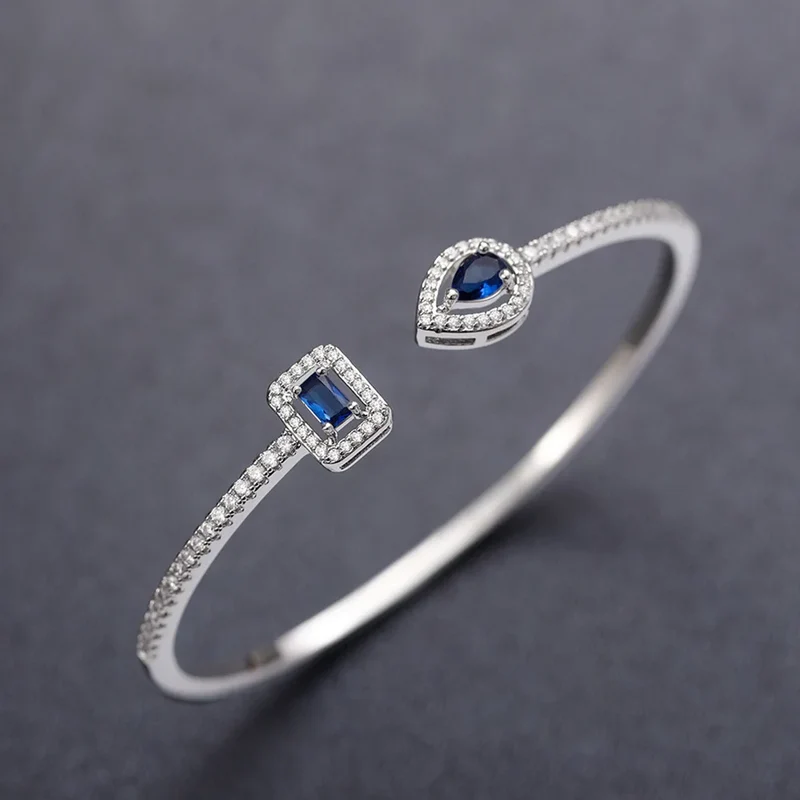 Platinum Diamond Bracelet With Blue Sapphire Emerald Cut Diamonds Minimalist Design For Women Everyday Wear