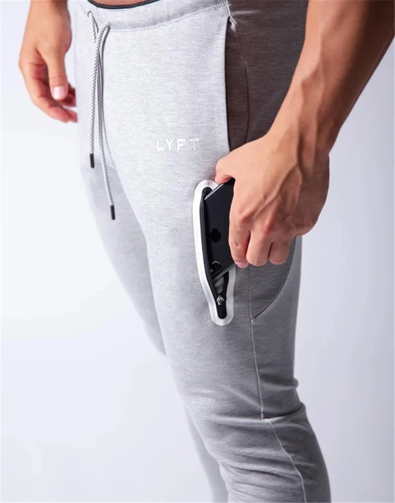 2019 Men's Sports Pants Men's Slim-Fit Elastic Invisible Zipper Casual Pants Stretch Cotton Foot-Retaining Pants Men's