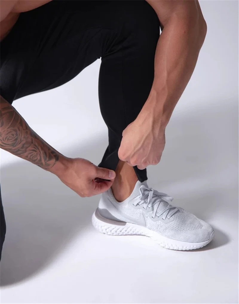 2019 Men's Sports Pants Men's Slim-Fit Elastic Invisible Zipper Casual Pants Stretch Cotton Foot-Retaining Pants Men's