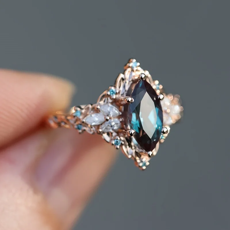 Elegant Marquise Synthetic Crystal Engagement Ring for Women | Copper 6-Prong Set, June Birthstone, Rose-Tone Leaf Design